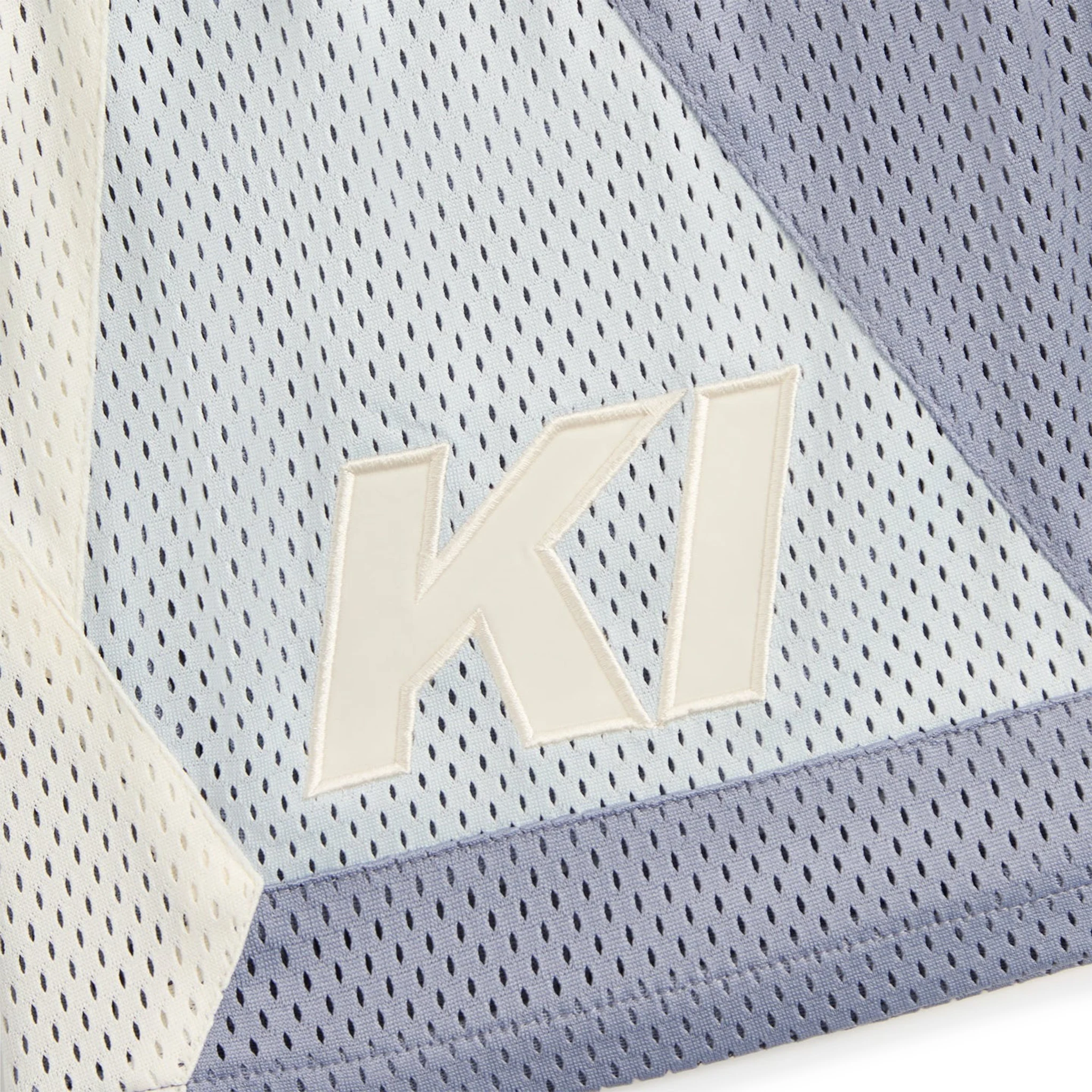 Logo view of Kith Mesh Turbo Shorts Monet